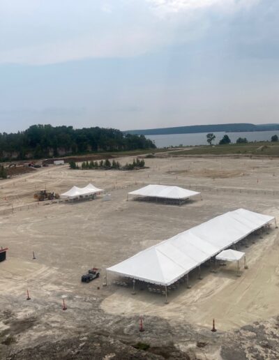Aerial view of the stage and tents being set up on the quarry floor
